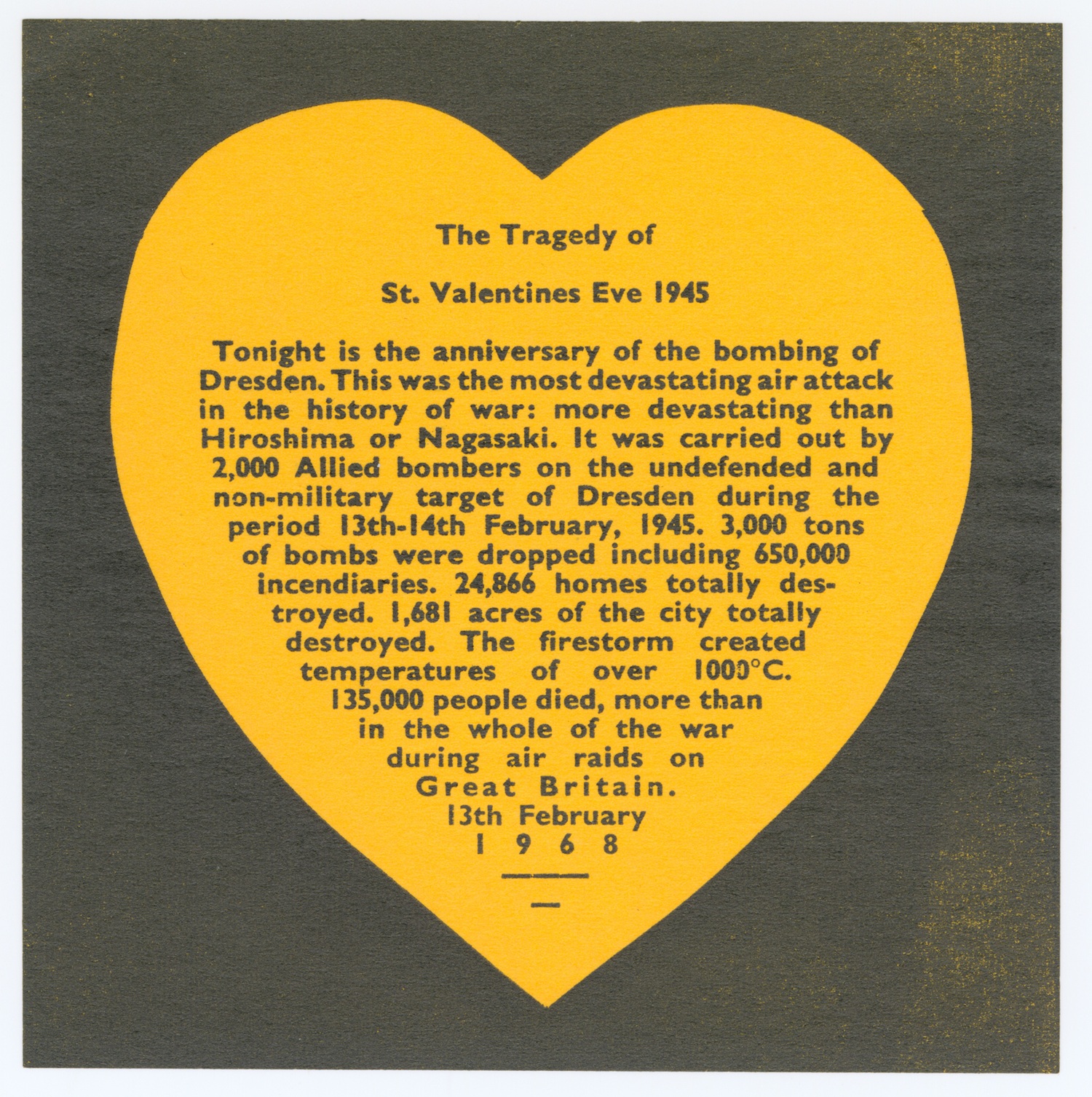 Yellow heart-shaped piece of paper with text about the bombing of Dresden 1945